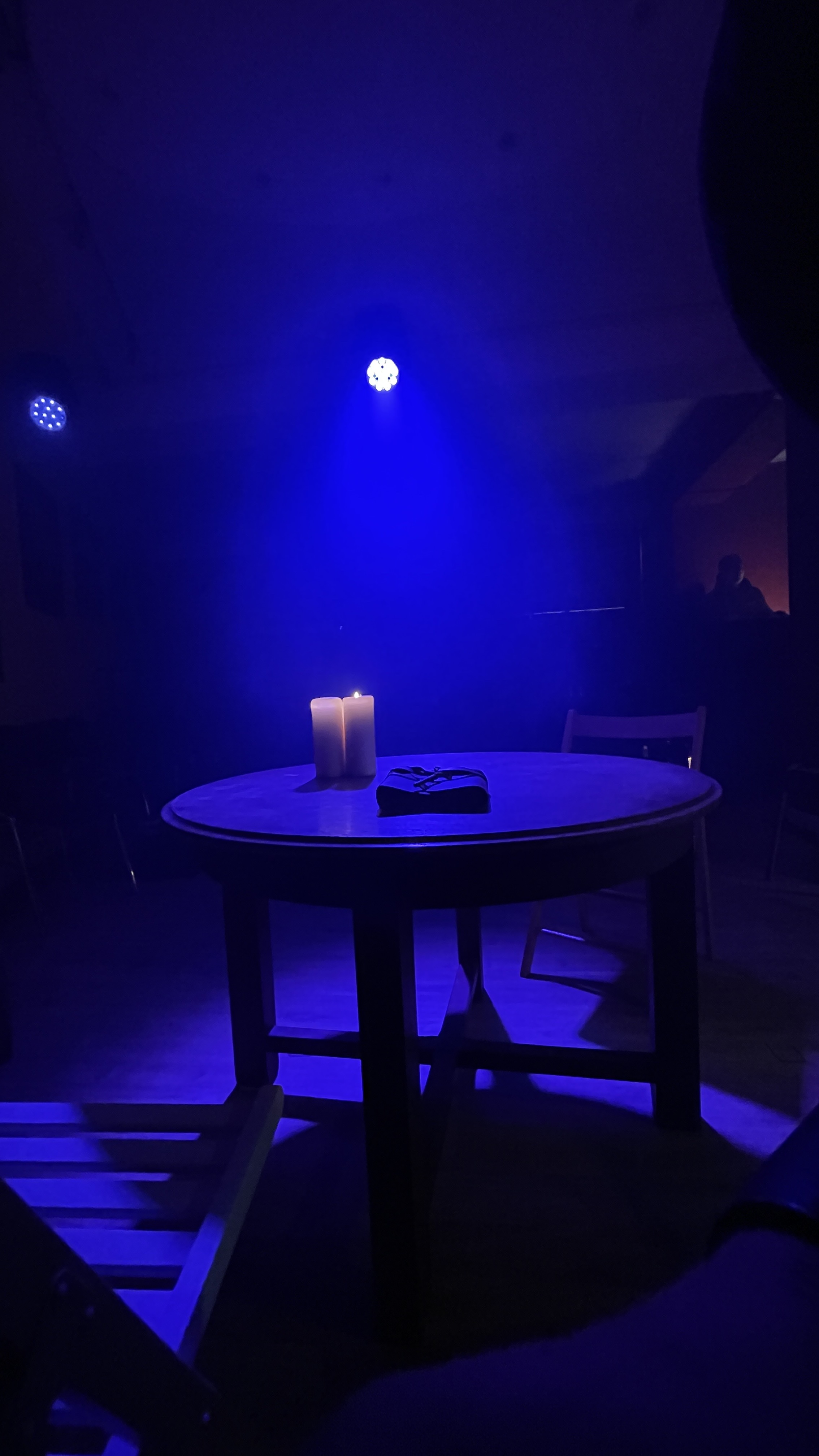 The table for Emma’s Diary in theatrical light