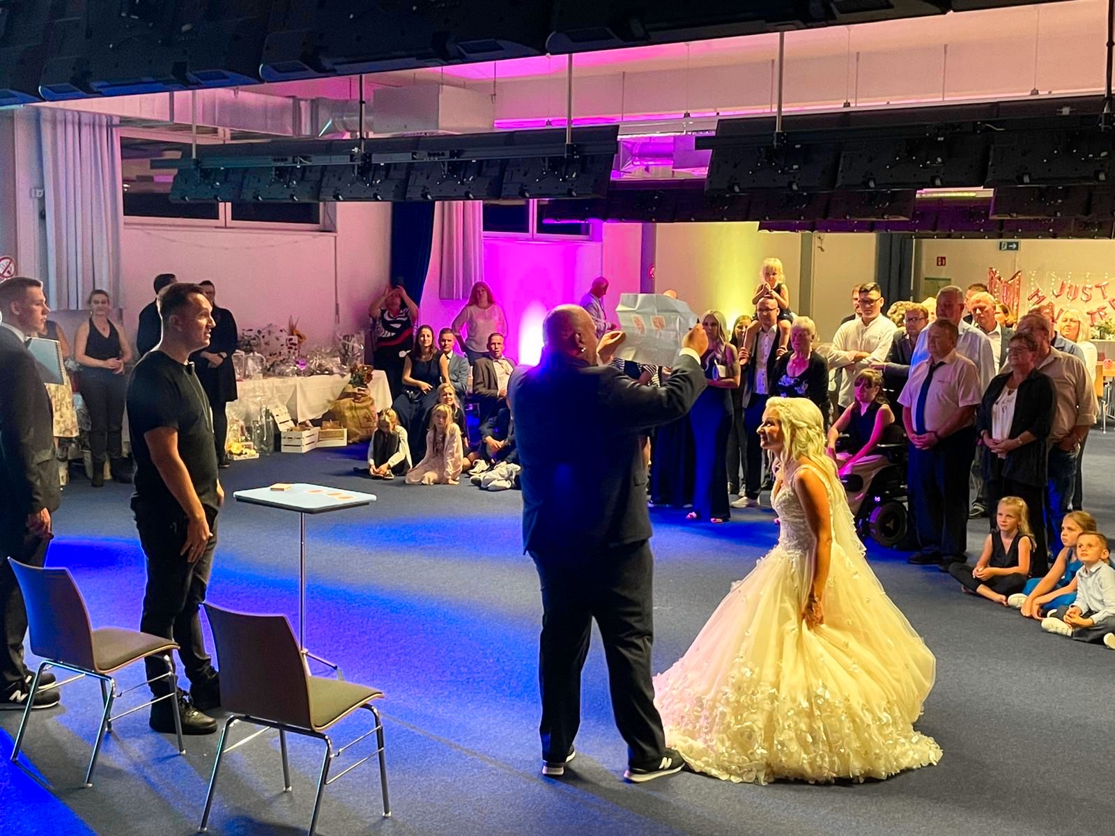 Audience gathered around Marc Sueper during a mentalism show